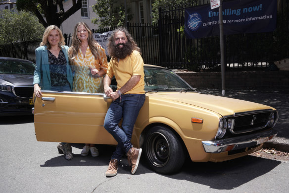 Justine Clarke with Zemiro and Georgiadis, in front of the gold Toyota Corolla.