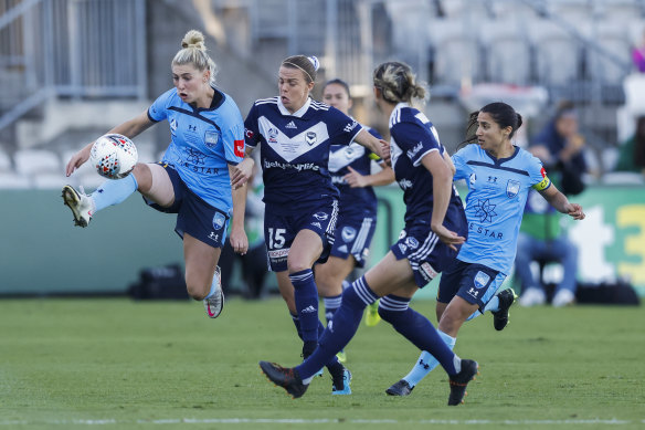 Sydney FC’s Remy Siemsen and Victory’s Amy Jackson battle for possession.