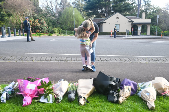 Floral tributes are left for the Queen at Government House on Friday.