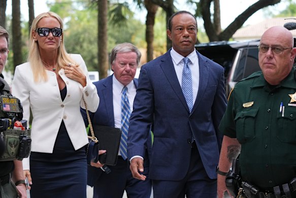 Tiger Woods arrives at court in Florida with girlfriend Vanessa Trump.