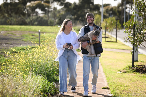 Emily Thorpe and Mason Frenkel, with dog Frankie, are among the young people moving to Werribee.