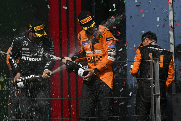 Piastri (centre) celebrates on the podium with third-placed Mercedes driver Lewis Hamilton (left) and McLaren’s Lando Norris, who came second.