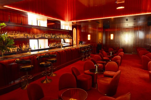 The “deep-red cocoon” of Clocktower Bar.