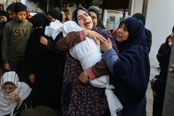 Rania Abu Anza and others mourn as they receive the dead bodies of victims of an Israeli strike in Rafah, on March 3.