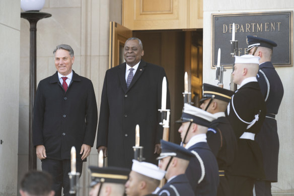 Secretary of Defence Lloyd Austin, centre, welcomes Defence Minister Richard Marles at the Pentagon.