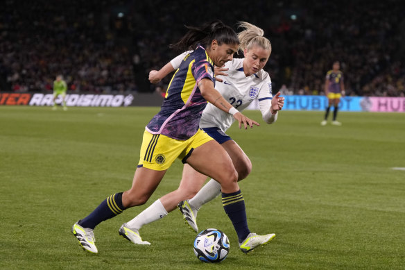 Colombia’s Catalina Usme, left, and England’s Alessia Russo challenge for the ball.