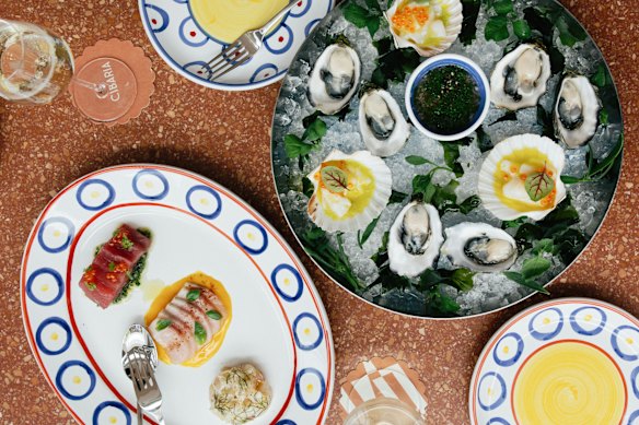 Seafood from the raw bar includes Boomer Bay oysters with mignonette, local Mooloolaba tuna crudo and scallops with lemon oil.