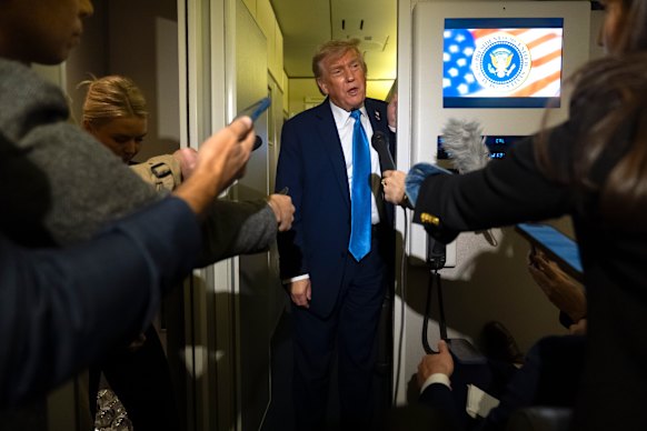 Donald Trump speaks to reporters after exiting the G7 meeting early.