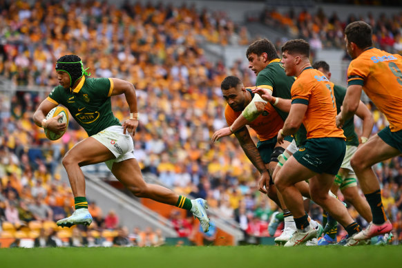 Kurt-Lee Arendse of the Springboks runs with the ball.