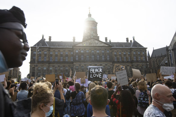 People take part in a Black Lives Matter protest in front of the Royal Palace on Dam Square in Amsterdam, Netherlands.