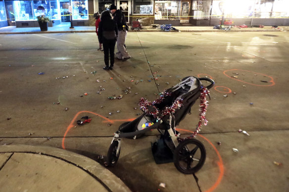 A broken stroller on West Main Street in Waukesha, Wisconsin, after car drove into a parade of Christmas marchers.