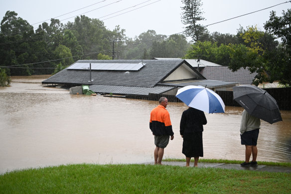 Residents survey the damage in Goodna, west of Brisbane.