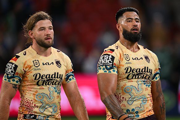 Broncos stars Pat Carrigan and Payne Haas after another Warriors try.
