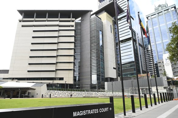 A barefoot Travis John Scorer wore a detainee’s uniform in Brisbane Magistrates Court on Wednesday.