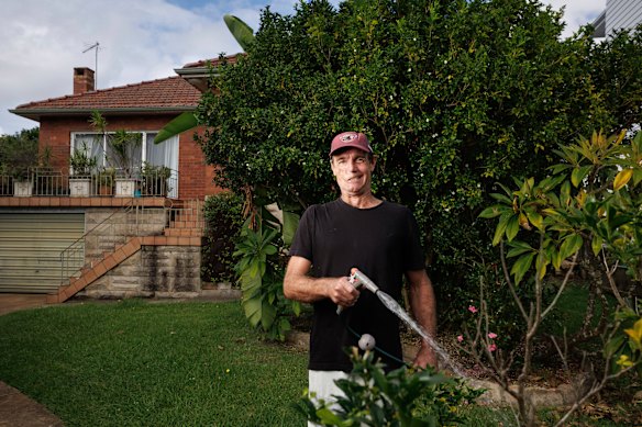 Page, 58, is pictured outside the family home in Manly Vale. He intends to stay as his mother is in a nursing home down the street.