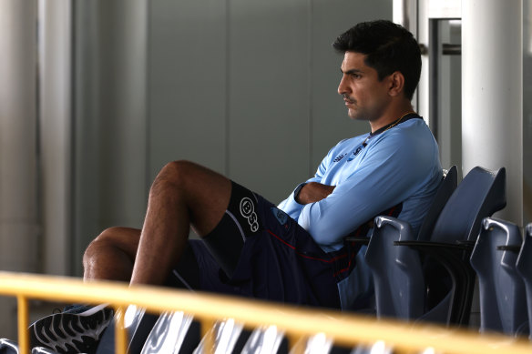 Jason Sangha of New South Wales looks on from the players rooms after being substituted due to  concussion protocols during the Sheffield Shield match between Western Australia and New South Wales at the WACA
