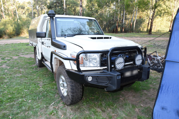 Russell Hill’s Toyota LandCruiser ute with a guy rope attached between it and a toilet tent.