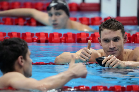 American swimmer Ryan Murphy gives a thumbs up to ROC’s Evgeny Rylov. Murphy later walked back his suggestion that their race wasn’t “clean”.