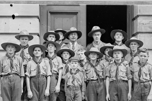 Wolf Cubs and Boy Scouts standing outside a hall, New South Wales, ca. 1930.