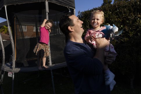 Sydney father and carer Nick Duffy, with daughters Louella and Harriet, said it is important for male leaders who are also fathers to lead by example and take parental leave if they can.