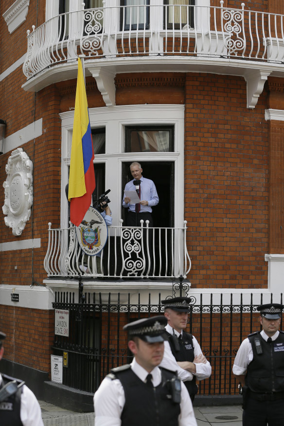 Assange makes a statement from the Ecuador embassy in 2012.