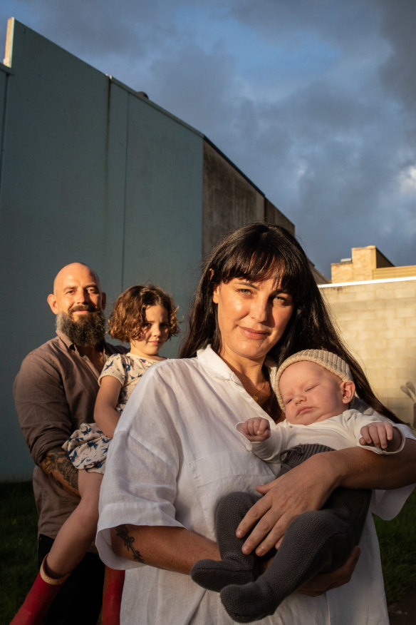 Karri Crossing and Hayden Muirhead had to climb onto their roof with one-week-old baby Ziggy and daughter Juno, 6, to survive the “horror” flood.