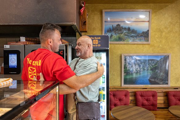 Co-owner Jovan Radevski greets a customer. 