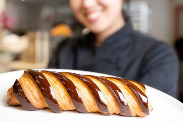 Co-founder Frances Song with a chocolate bar croissant at Moon Phase in St Leonards.
