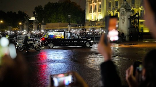 The hearse carrying Queen Elizabeth II’s coffin arrives at Buckingham Palace in London.