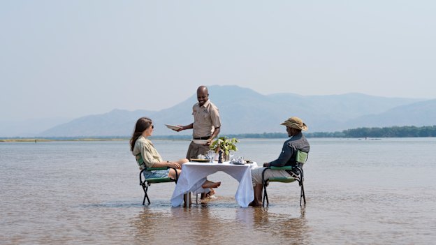 Lunch is served … a private dining experience on the Zambezi River at Sausage Tree Camp in Zambia. 