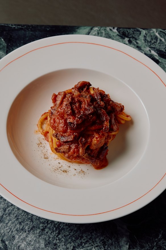 The signature sauce is baked with eggs and tangled through spaghetti. 