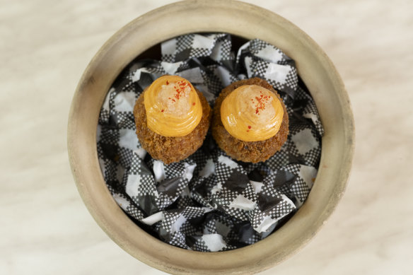 Pork croquettes with ’nduja mayonnaise and finger lime.