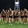 Hawthorn walks off the ground after losing to the Suns.