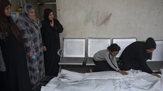 Palestinians mourn their relatives killed in the Israeli bombardment of the Gaza Strip, at the hospital Rafah, southern Gaza, on Thursday.