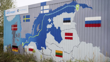 “Nord Stream 2 Committed. Reliable. Safe.” hangs above a painted map at the natural gas receiving station in in Lubmin, Germany.