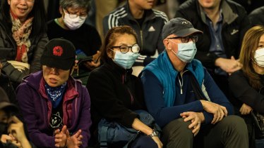 Many protesters wore masks to prevent themselves from being identified, and eye patches.