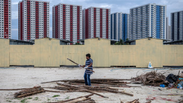 Newly-constructed apartment blocks stand on artificial islands up to three metres above sea level as the Maldives seek to mitigate climate change and rising sea levels.