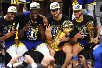 Andre Iguodala, Draymond Green, Klay Thompson and Stephen Curry  of the Golden State Warriors after claiming the NBA championship for a  fourth time.