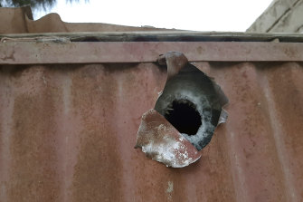 A mortar shell hole in a shipping container after an airstrike against the Taliban in Lashkar Gah.