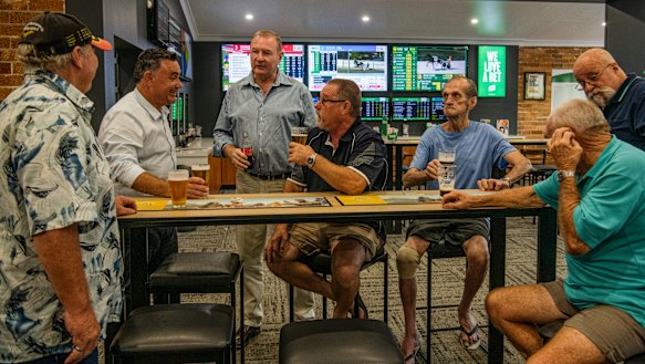 Nationals leader John Barilaro with Stephen Bromhead, the Nationals candidate for Myall Lakes, with locals in Taree. 
