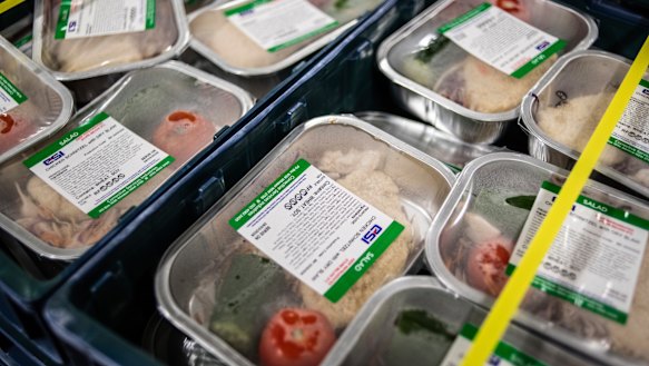 Some of the pre-prepared frozen food is heated and served to the prisoners.