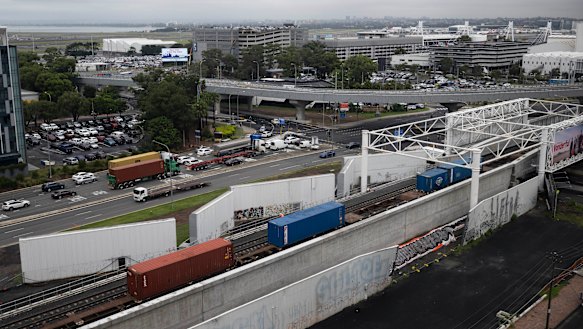 A train passes over the newly completed duplicated rail line near Sydney Airport’s domestic terminal.