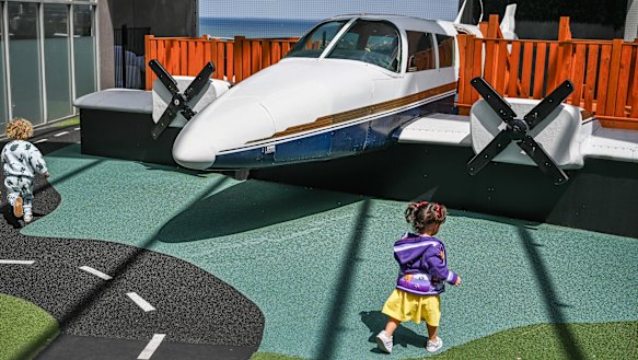 Woodlands Long Day Care & Kindergarten, St Kilda Road. Children play in front of the airplane, which Woodlands had installed using a crane.
