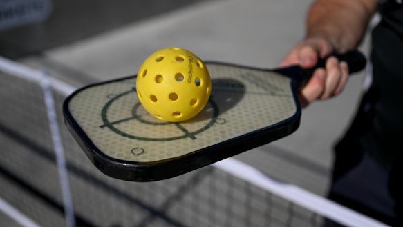 Pickleball racquets are a super-light paddle, bigger than a table tennis bat but smaller than a tennis racquet. The balls are made of perforated plastic.