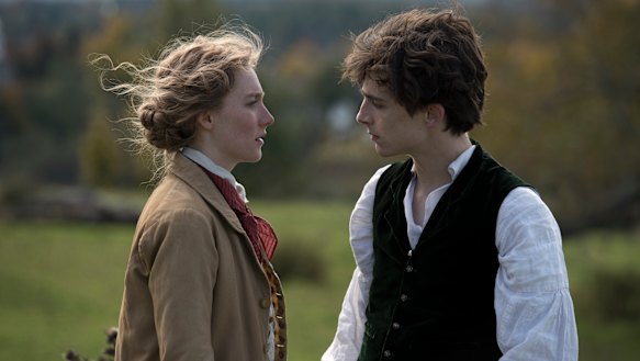 Saoirse Ronan as Jo and Timothee Chalamet as Laurie in Little Women.