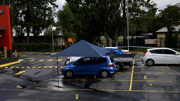 A blue Honda Jazz in the parking lot of Campbelltown McDonald's is part of the police investigation into the suspected fatal stabbing of a paramedic on Friday morning.