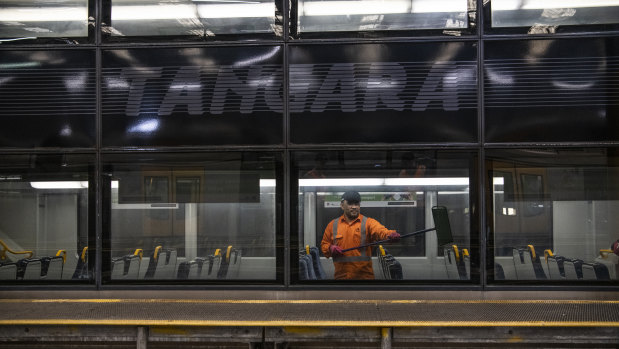 A Sydney trains cleaner on a Tangara at Mortdale Depot. 