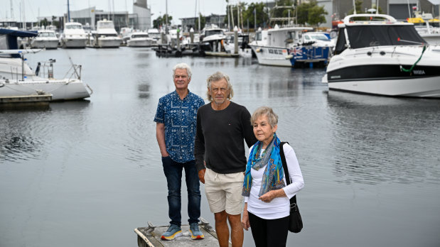 Queenscliff residents Cathie Bond (front), David Connoley (centre) and David Kenwood (back) at Queenscliff harbour on Thursday.