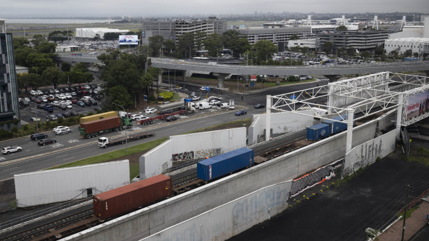 A train passes over the newly completed duplicated rail line near Sydney Airport’s domestic terminal.