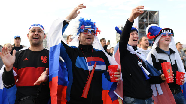 Reasons to smile: Russian football supporters.